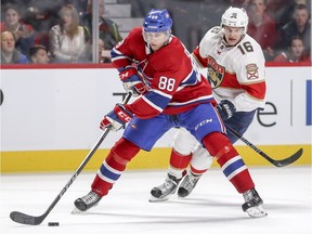 Montreal Canadiens defenceman Brandon Davidson passes the puck under pressure from Florida Panthers Aleksander Barkov on Sept. 29, 2017. When  Davidson has been on on the ice this season, the Canadiens see a significant, if not jaw-dropping, decrease in shots against.