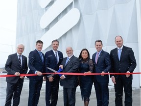 Ceremonial ribbon cutting during the inauguration of the $1.3-billion Ericsson plant in Vaudreuil-Dorion on Dec. 9., 2016. Mayor Guy Pilon, holding the oversized scissors, is confident another firm will take over Ericsson's high-tech facility in Vaudreuil-Dorion.