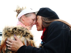 Wearing a traditional karowai, or cloak, Brooke Henderson of Smiths Falls receives a Maori hongi greeting after winning the New Zealand Women's Open on Monday in Auckland.