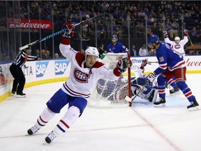 Canadiens' Brendan Gallagher celebrates a first period goal by Max Pacioretty (on ice) that was later disallowed against the New York Rangers at Madison Square Garden on Sunday, Oct. 8, 2017, in New York City.