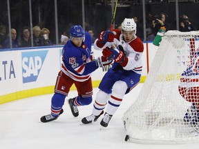 Steven Kampfer (#47) of the New York Rangers pursues Charles Hudon (#54) of the Montreal Canadiens during the third period at Madison Square Garden on Oct. 8, 2017 in New York City.