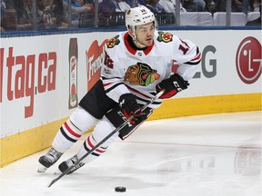 Chicago's rookie right-winger Alex DeBrincat scored his first NHL goal, added an assist and was named the second star in a 3-1 Blackhawks win over the Canadiens Tuesday night.