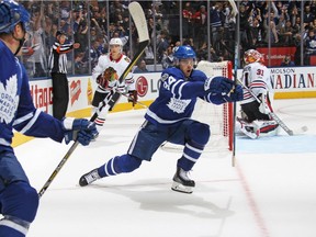 Auston Matthews of the Toronto Maple Leafs scores the overtime winning goal against the Chicago Blackhawks in an NHL game at the Air Canada Centre on October 9, 2017 in Toronto, Ontario.