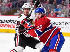 Canadiens defenceman Victor Mete defends against the Chicago Blackhawks' Brandon Saad during game at the Bell Centre in Montreal on Oct. 10, 2017.