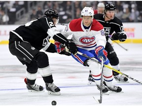 The Canadiens' Ales Hemsky attempts to poke the puck around the Los Angeles Kings' Derek Forbort during the first period at Staples Center.