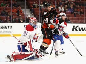 Canadiens rookie defenceman Victor Mete defends against the Ducks' Jared Boll during first-period action at the Honda Center in Anaheim on Oct. 20, 2017.