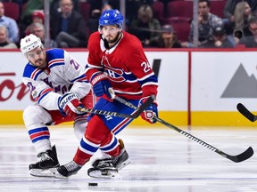 Rangers' Kevin Shattenkirk challenges Canadiens' Phillip Danault during the NHL game at the Bell Centre on Saturday, Oct. 28, 2017.