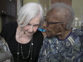 Una Adams, right, speaks with Anne Crevier, during a party at the Vista senior's home on Friday September 29, 2017.