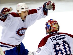 Canadiens' Doug Gilmour celebrates with goaltender José Theodore after the Habs eliminated the Boston Bruins from the playoffs on April 29, 2002.
