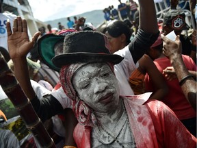 A devotee takes part in a ceremony honouring Haitian voodoo spirits in Port-au-Prince. In 1942, Dr. Walter Cannon coined the term “voodoo death” to describe demise brought on by a strong emotional shock, and described a number of cases in which death occurred apparently as a result of a belief that a curse had been imparted.