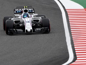 AUTO-PRIX-JPN-F1

Williams' Canadian driver Lance Stroll drives round the corner during the qualifying practice of the Formula One Japanese Grand Prix at Suzuka on October 7, 2017. / AFP PHOTO / Toshifumi KITAMURATOSHIFUMI KITAMURA/AFP/Getty Images
TOSHIFUMI KITAMURA, AFP/Getty Images