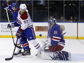 New York Rangers goalie Henrik Lundqvist makes a save in front of Canadiens' Max Pacioretty on Sunday, Oct. 8, 2017, in New York.