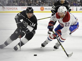 The Los Angeles Kings' Michael Cammalleri, takes the puck wide against Canadiens defenceman Karl Alzner during the second period of game at the Staples Centre.