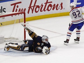 Canadiens forward Jonathan Drouin puts the puck past Sabres goalie Robin Lehner to win the game in a shootout in Montreal's season opener.