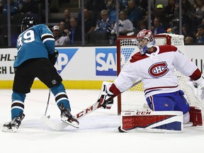 Montreal Canadiens goalie Carey Price (31) looks back as San Jose Sharks centre Logan Couture (39) scores a goal during the first period of an NHL hockey game, Tuesday, Oct. 17, 2017, in San Jose, Calif.