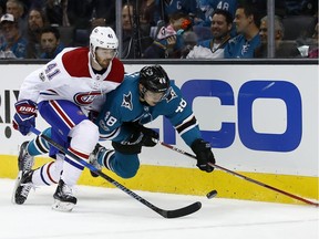 San Jose Sharks centre Tomas Hertl (48) trips as he chases after the puck against Montreal Canadiens left wing Paul Byron (41) during the first period of an NHL hockey game, Tuesday, Oct. 17, 2017, in San Jose, Calif.