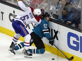 San Jose Sharks right-wing Joonas Donskoi (27) is checked into the boards by Canadiens defenceman Shea Weber (6) during the third period of an NHL hockey game, Tuesday, Oct. 17, 2017, in San Jose, Calif. San Jose won 5-2.