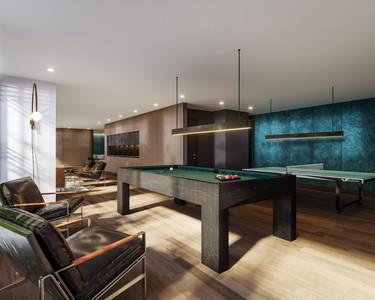 A pool table and ping pong table in the game room.