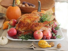 This Oct. 12, 2015, photo shows a roasted Thanksgiving turkey in Concord, New Hampshire. Hosting your first Thanksgiving dinner away from home is a rite of passage, as Stephanie Veniez found out with a punctured roasting pan and some duct tape. THE CANADIAN PRESS/AP-Matthew Mead