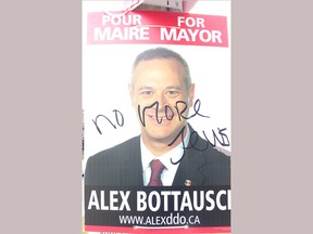 Mayoral candidate Alex Bottausci came across one of his posters scrawled with a hate message. Bottausci is running for mayor in Dollard-des-Ormeaux. Photo courtesy of Alex Bottausci
