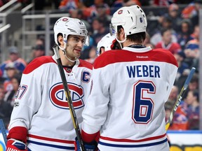 Canadiens' Max Pacioretty and Shea Weber discuss the play during the game against the Oilers on March 12, 2017, in Edmonton.