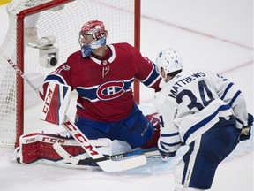 Toronto Maple Leafs' Auston Matthews scores an overtime goal on Canadiens goalie Carey Price on Oct. 14. Matthews is uncertain for Saturday's match against Montreal because of a lower-body injury.