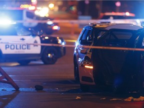 An officer's hat is seen on the ground as Edmonton Police Service officers investigate after a man attacked a police officer outside of an Edmonton Eskimos game at 92 Street and 107A Avenue in Edmonton, Alberta on Sunday, October 1, 2017. Ian Kucerak / Postmedia