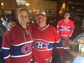 Mary McGill, who organized this year's Hockey Inside/Out Summit, with Ian Cobb, who organized previous ones, at Darcy McGee's bar near the Canadian Tire Centre in Ottawa on Oct. 30, 2017.
