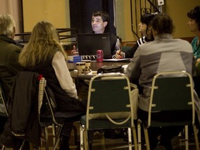 Robert Grimaudo (centre) meets with his mayoral campaign team in St. Lazare in October 2013. Grimaudo, St-Lazare's current mayor, is seeking re-election on Nov. 5.