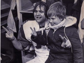 Gordon Judges and his son Brett celebrate after the Alouettes won the Grey Cup in 1977 at Olympic Stadium.