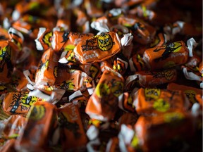 Molasses Kisses Halloween candy by Kerr's Candy are shown in Toronto on Thursday, Oct. 26, 2017. "I’ve often felt guilty about it, but I let my son get sugar highs on Halloween. After trick or treating, we’d plop ourselves down on the floor and sort his candy into enormous piles, and then sit back and admire them together. The huge piles of candy seemed amazing, impossible even," Julie Anne Pattee writes.