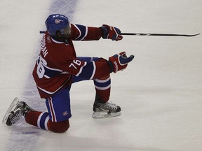 Seeing P.K. Subban play for the Montreal Canadiens was a dream come true for his father, Karl Subban. Above, P.K. celebrates his OT goal in Montreal on April 5, 2011