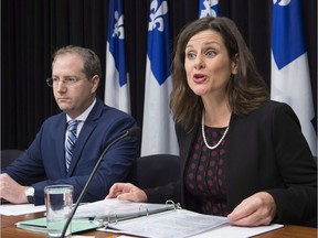 Quebec Justice Minister Stephanie provides further details about how the government's controversial Bill 62 will be implemented at the legislature, as Justice official Yan Paquette, left, looks on in Quebec City Tuesday, October 24, 2017. The law bans people from giving or receiving public services if their face is covered.