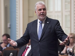 Quebec Premier Philippe Couillard responds to the Opposition during question period Sept. 19, 2017 at the legislature in Quebec City.