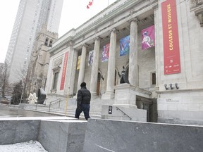 A Montrealer walks past the Montreal Museum of Fine Arts on Tuesday March 14, 2017.