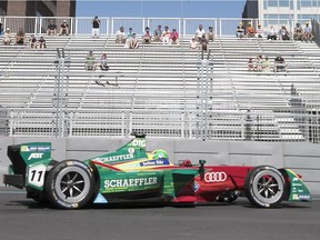Formula E driver Lucas Di Grassi of Brasil races his Abt Schaeffler Audi Sport car by empty stands during the morning practice round July 30, 2017 in Montreal.