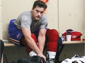 The Canadiens' Jonathan Drouin ties his skates before skating with other NHL players at Lower Canada College in Montreal on Aug. 28, 2017.