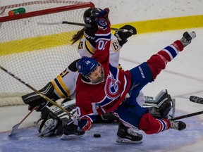 The Montreal Canadiennes forward Noémie Marin is upended in front of the Boston Blades goal during a 5-3 Montreal win over Boston in CWHL action at Michel-Normandin Arena in Montreal on Oct. 15, 2017.