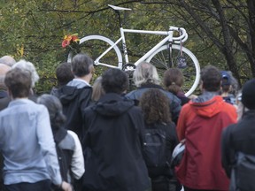 Clement Ouimet's bike is displayed during a ghost bike ceremony on Camillien-Houde Way on Oct. 25, 2017.