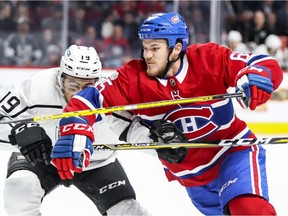 Montreal Canadiens' Andrew Shaw muscles his way past  Los Angeles Kings Alex Iafallo during third period of National Hockey League game in Montreal Thursday October 26, 2017.
