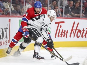 Canadiens' Alex Galchenyuk reaches around Kings' Michael Amadio for the puck during first period of game at the Bell Centre last month.