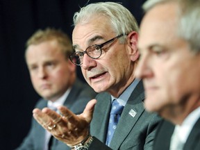 UPAC head Robert Lafreniere holds press conference with Andre Boulanger, director of operations, left, and associate commissioner Marcel Forget, right, in Montreal Oct. 31, 2017 to address questions about the police operation that lead to the arrest of Chomedey MNA Guy Ouellette last week.