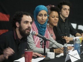 Jaouad Laaroussi, left, and other members of anti-racism groups gather in Montreal on Wednesday, Nov. 1, 2017 to speak about the upcoming demonstration on Sunday, Nov. 12, 2017