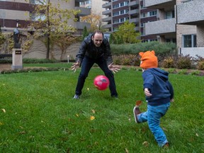 Faisal Alazem and his 2-year-old son Fares play on the green space in front of their apartment building in downtown Montreal on Thursday, Nov. 2, 2017. Alazem exemplifies some of the major issues confronting residents of the Ville-Marie borough, which is one of the interesting races to watch in the Nov. 5 election.