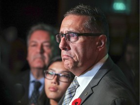 Pierrefonds-Roxboro borough mayor Jim Beis, who was re-elected, watches as municipal election results come in at the Équipe Denis Coderre headquarters in Montreal on Sunday night.