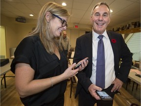 Newly elected mayor for the city of Pointe Claire John Belvedere and wife Sandra Hudon are all smiles as they check election results Nov. 5, 2017.