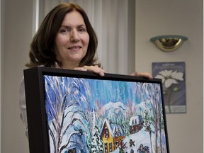 Melpa Kamateros, executive director of Shield of Athena, displays a painting by Katerina Mertikas that will be auctioned off to raise money to help fund its Second Step Resource centre.