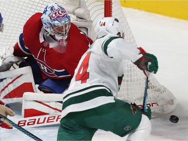 Montreal Canadiens goalie Charlie Lindgren follows puck after shot by Minnesota Wild's Mikael Granlund (64) during first period NHL action in Montreal on Thursday November 9, 2017.