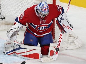 Montreal Canadiens goalie Charlie Lindgren stops puck during first period NHL action in Montreal on Thursday November 9, 2017.