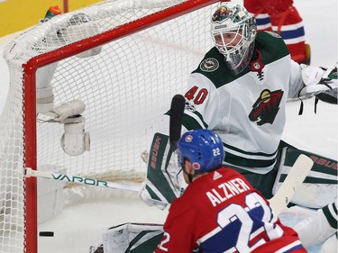 Montreal Canadiens' Karl Alzner (22) puts puck past Minnesota Wild's Devan Dubnyk during first period NHL action in Montreal on Thursday November 9, 2017. The goal was not allowed because it was put in with a high stick from Alzner.